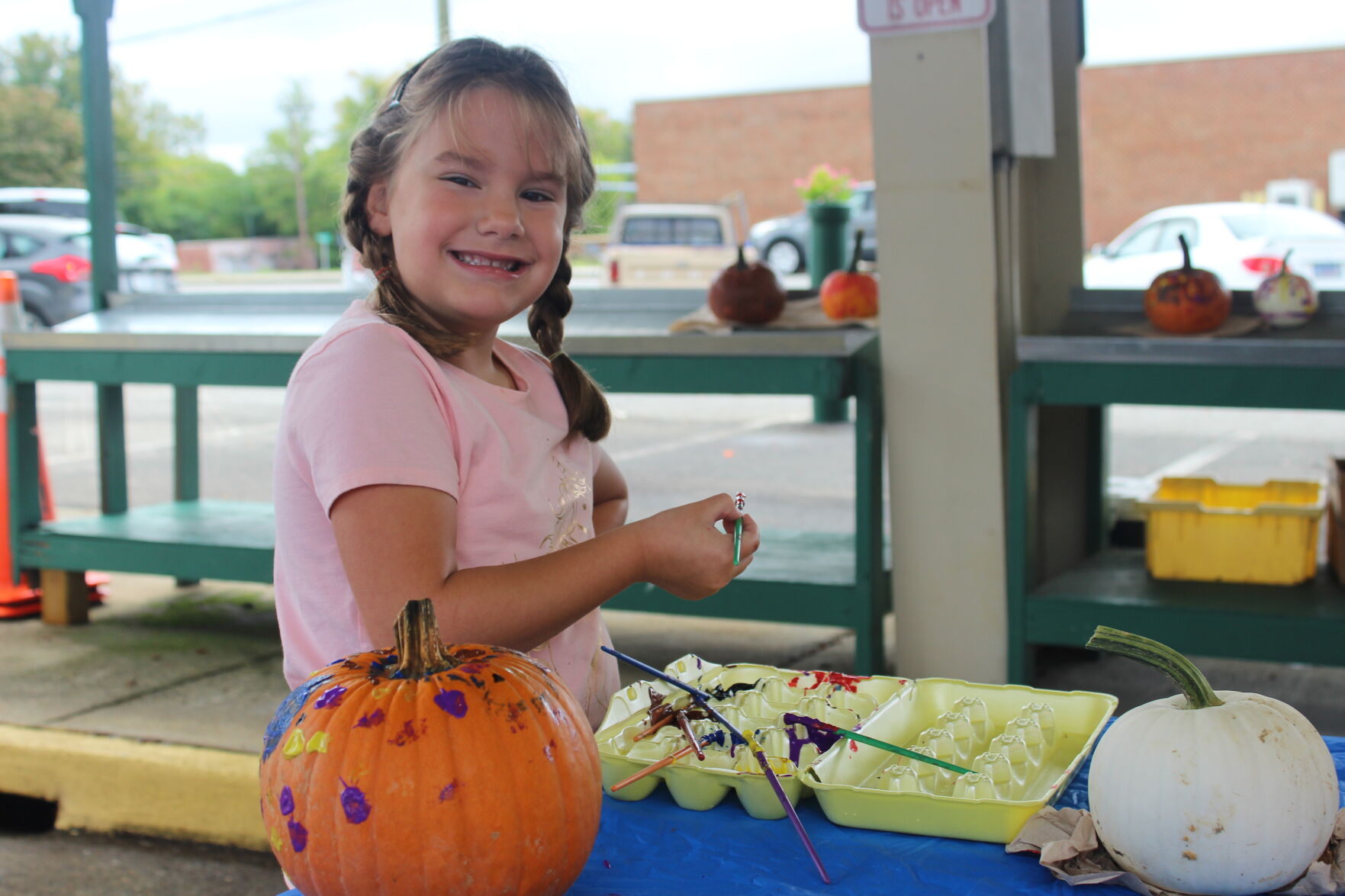 Addilynn Haislip painting pumpkins